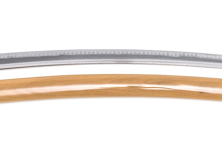 More details of blade of Japanese sword near scabbard on white background. Made of premium steel called 'Tamahagane'の写真素材