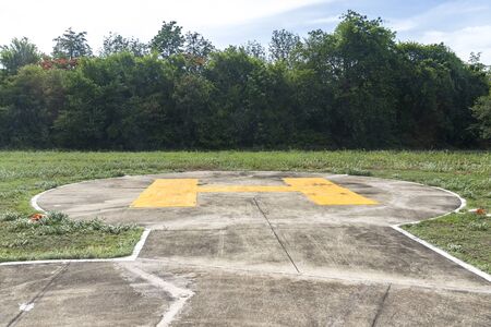 Heliport There are many trees in the background. On a sunny day.の写真素材