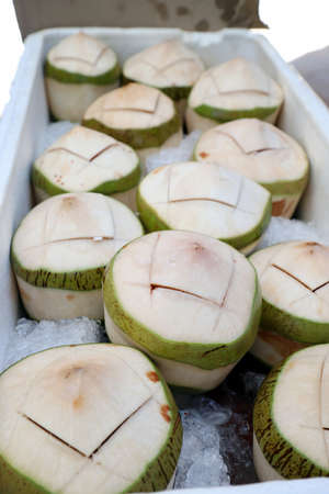 Cold fresh coconut Soak ice in a foam crate Cut openingsの写真素材