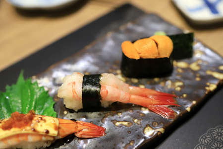 Shrimp sushi  on a traditional Japanese plate in a Japanese restaurant.の写真素材