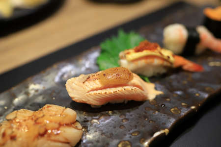 Premium salmon sushi on Japanese dish in the restaurant.の写真素材