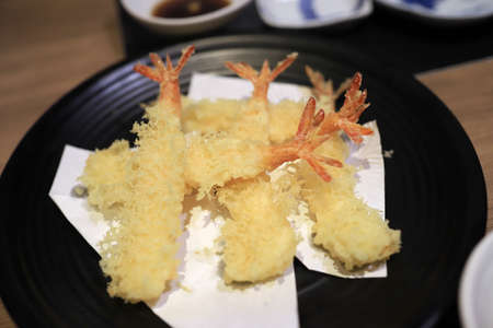 Shrimp tempura looks delicious on the plate. In a japanese restaurant. Selective focus.の写真素材