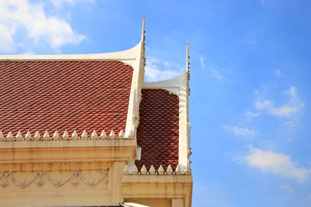 Roof of thai temple The background is a blue sky during the day.の写真素材