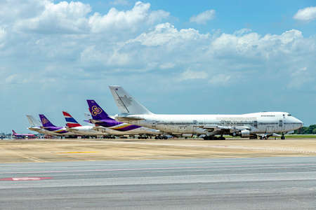 Bangkok, Thailand June 14th, 2018;  Don Mueang International Airport (DMK)  apron There are planes of Thai Airways parked lined up. There was an unpainted plane parked at the very front in sunny day.のeditorial素材
