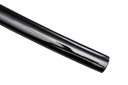 Close up shot of Saya - shiny glossy black scabbard starry style of a Katana - Japanese long Sword isolated in white background. selective focus.の写真素材