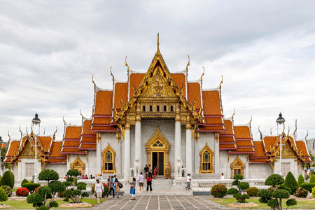 Bangkok, Thailand - Dec 4, 2022 : Tourists visiting Wat Benchamabophit Dusitvanaram (also known as the Marble Temple), a major destination in Bangkok. It shows that Thailand now welcomes tourists.のeditorial素材