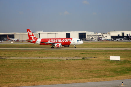 Bangkok Thailand - Mar 28, 2019: AirAsia (Budget airline that is highly popular in Thailand)'s airplanes are currently taxiing on the runway at Don Mueang International Airport, preparing for takeoff.のeditorial素材