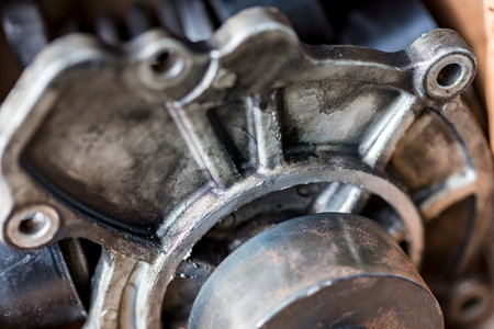 close up photo The focus is shallow, the mechanical parts are old. Black oil stains were firmly...