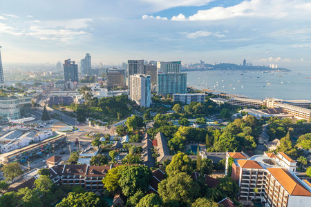 Chonburi, Thailand - 26 Oct. 2023 ; Morning view of Pattaya city Many tall buildings from above Dolphin circle area The picture is divided into halves road and sea can see the city to Bali Hai Pier.のeditorial素材