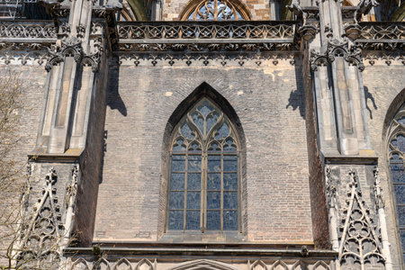 HDR image of Ulm Minster, the tallest church in the world, showcasing Gothic details under a clear blue sky on a sunny day. Perfect for travel, architecture, historical and inspiring design projects.の写真素材