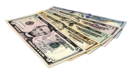 Heap of Dollar Bills isolated on white backgroundの写真素材