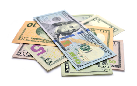 Heap of Dollar Bills isolated on white backgroundの写真素材