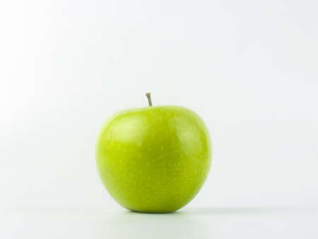 green apple granny smith on white backgroundの写真素材
