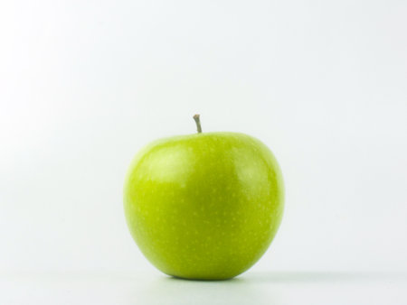 green apple granny smith on white backgroundの写真素材