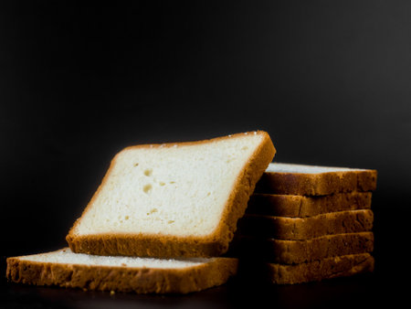 slice of bread on black background