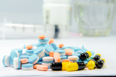 medicine color Blue-white Orange pill. Blue-white tablets and black-and-yellow capsules.の写真素材