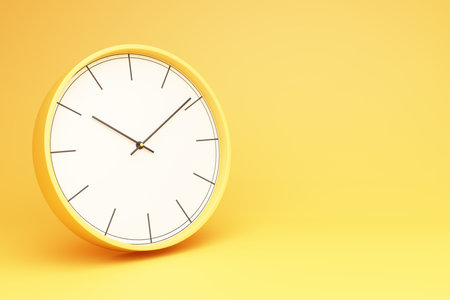 Yellow round table clock on a yellow background 3d renderingの写真素材