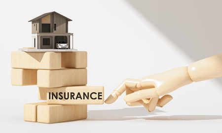 Wooden hand touching a block labeled âINSURANCEâ under a modern house, symbolizing home insurance and risk protection. 3d rendering.の写真素材