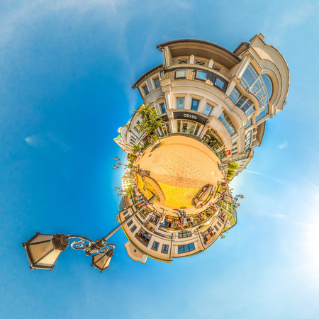 Yellow little planet panorama with architecture, soft blue sky and street lamp. Europe. Brest....