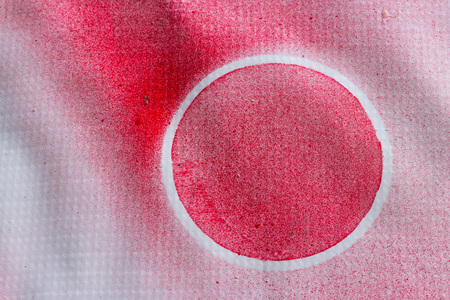 White circle at red background.の写真素材