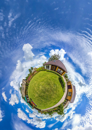 Green little planet panorama with architecture, soft blue sky and white clouds. Buildings at summer....