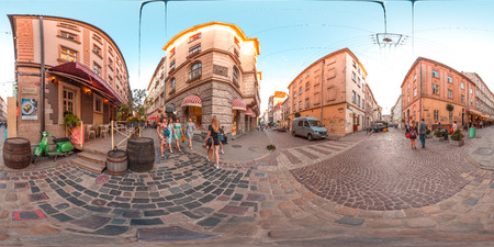 Lviv - summer, 2018: 3D spherical panorama with 360 degree viewing angle. Ready for virtual reality in vr. Full equirectangular projection.  Old town. City center. Buildings with blue sky. Summer. Evening.のeditorial素材
