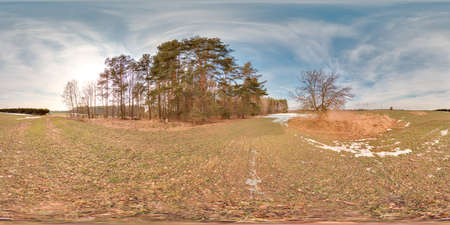 Amazing landscape with blue sky at spring trees without grass and greens with snow 3D spherical panorama with 360 degree viewing angle Ready for virtual reality vr Full equirectangular projectionの写真素材