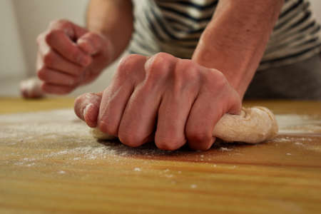 kneading pizza dough, at argentine homeの写真素材