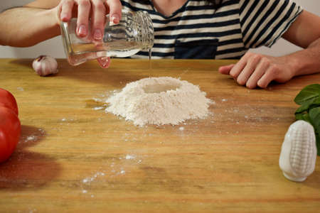 making pizza at home, with ingredientsの写真素材