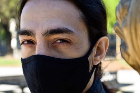 face of a man close up with a maskの写真素材