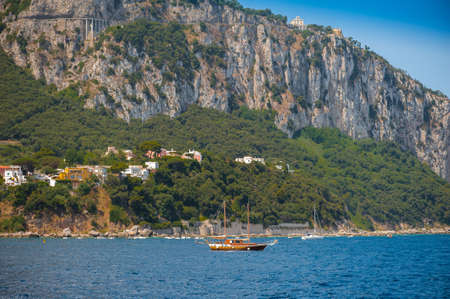 Wooden sailing yacht sails near the island of Capri, Mediterranean sea, Campania, Italyのeditorial素材