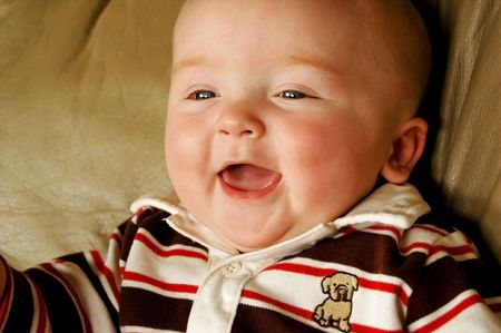 cute and chubby baby boy laughing