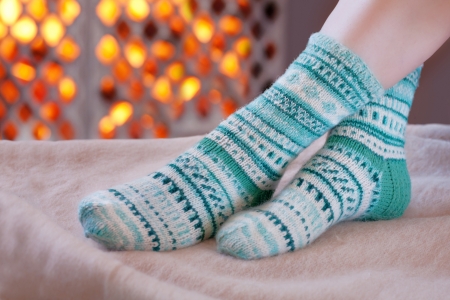 Warming up by the fireplace の写真素材