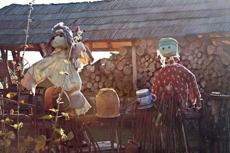 two scarecrows on a fenceの写真素材