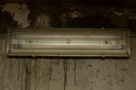 Fluorescent light on concrete wallの写真素材