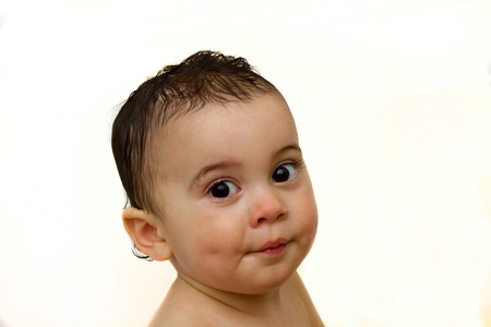 Happy little boy after taking bath, indoorsの写真素材