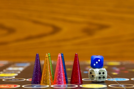 Blue, green and red plastic chips dice and Board games for childrenの写真素材