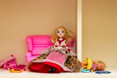 Children's toy doll interior room in a small format, tables, chairs, wardrobe and sofaの写真素材