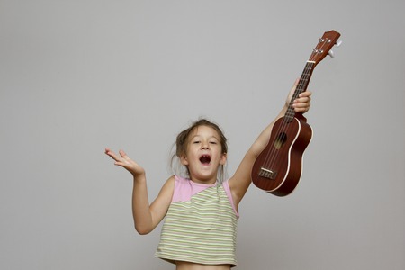 girl with ukulele guitarの写真素材