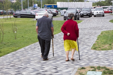 Elderly couple walking in the city.の写真素材