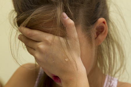 girl praying, crying, hopelessness, despair, prayer.の写真素材