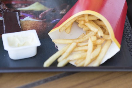 Fast food. French fries and sauce on a tray
