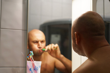 Man brushing his teethの写真素材