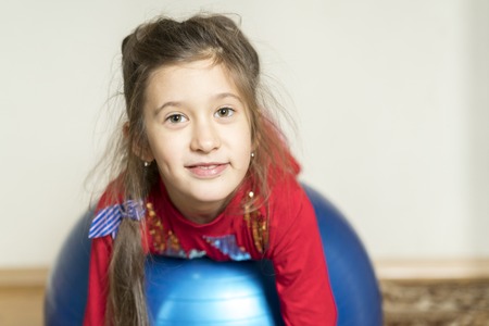 laughing girl on fitballの写真素材