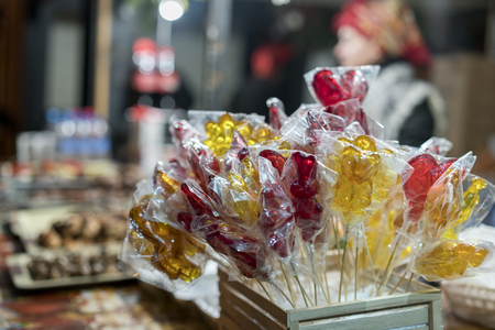Stall with colorful and festive candies at the Christmas market, selective focusの写真素材