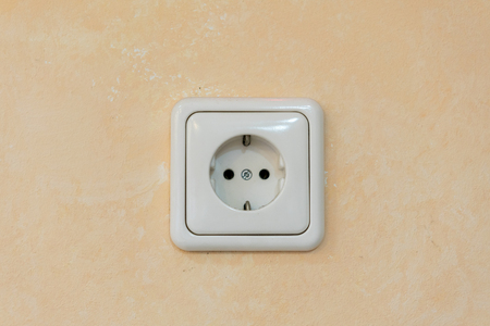 White rosette on a beige wallの写真素材