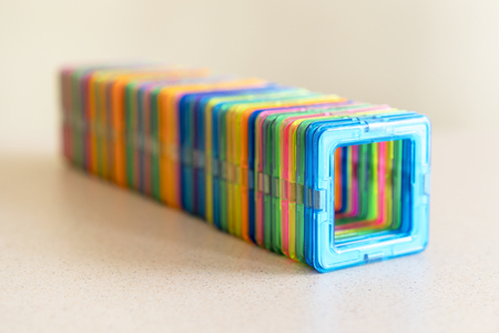 children's constructor on magnets. Many multicolored squaresの写真素材