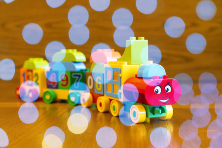 Children's locomotive with wagons, blue bokehの写真素材