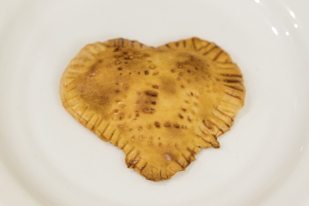 Cookies in the form of heart on a white plate. Homemade baking. Valentine's Day.