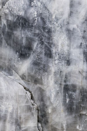 gray stone in cracks marble background.の写真素材